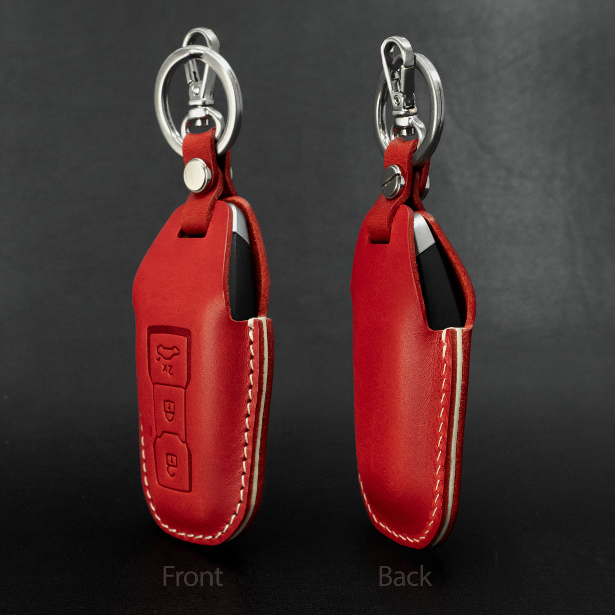 Audi key fob inserted into leather cover, showing fit