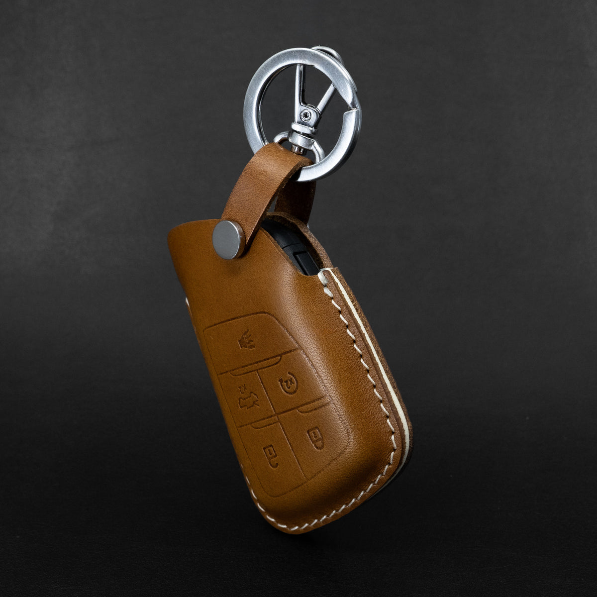 Chevy GMC key fob leather case shown with truck interior context