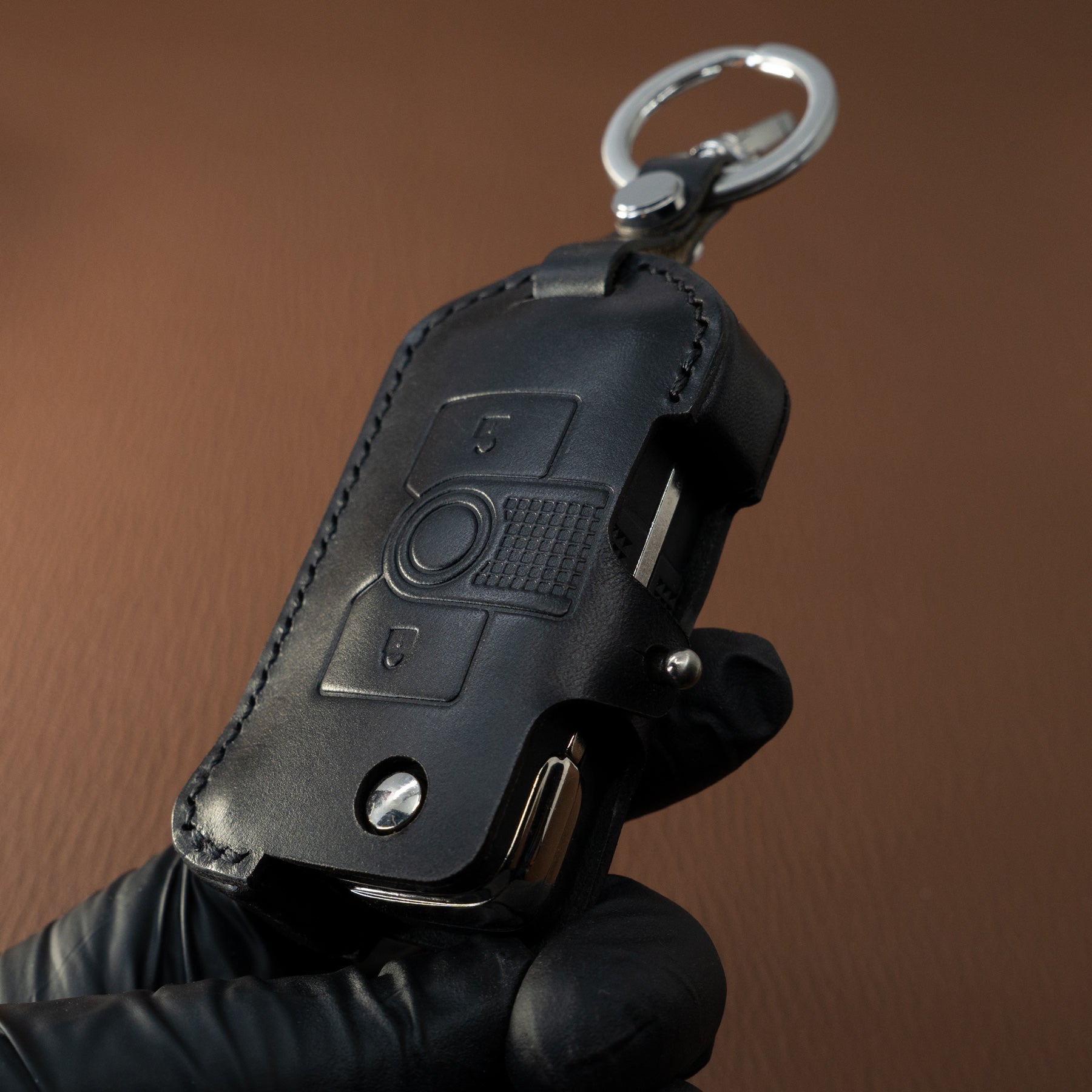 Handmade saddle-stitched leather key fob case for INEOS Grenadier – side view