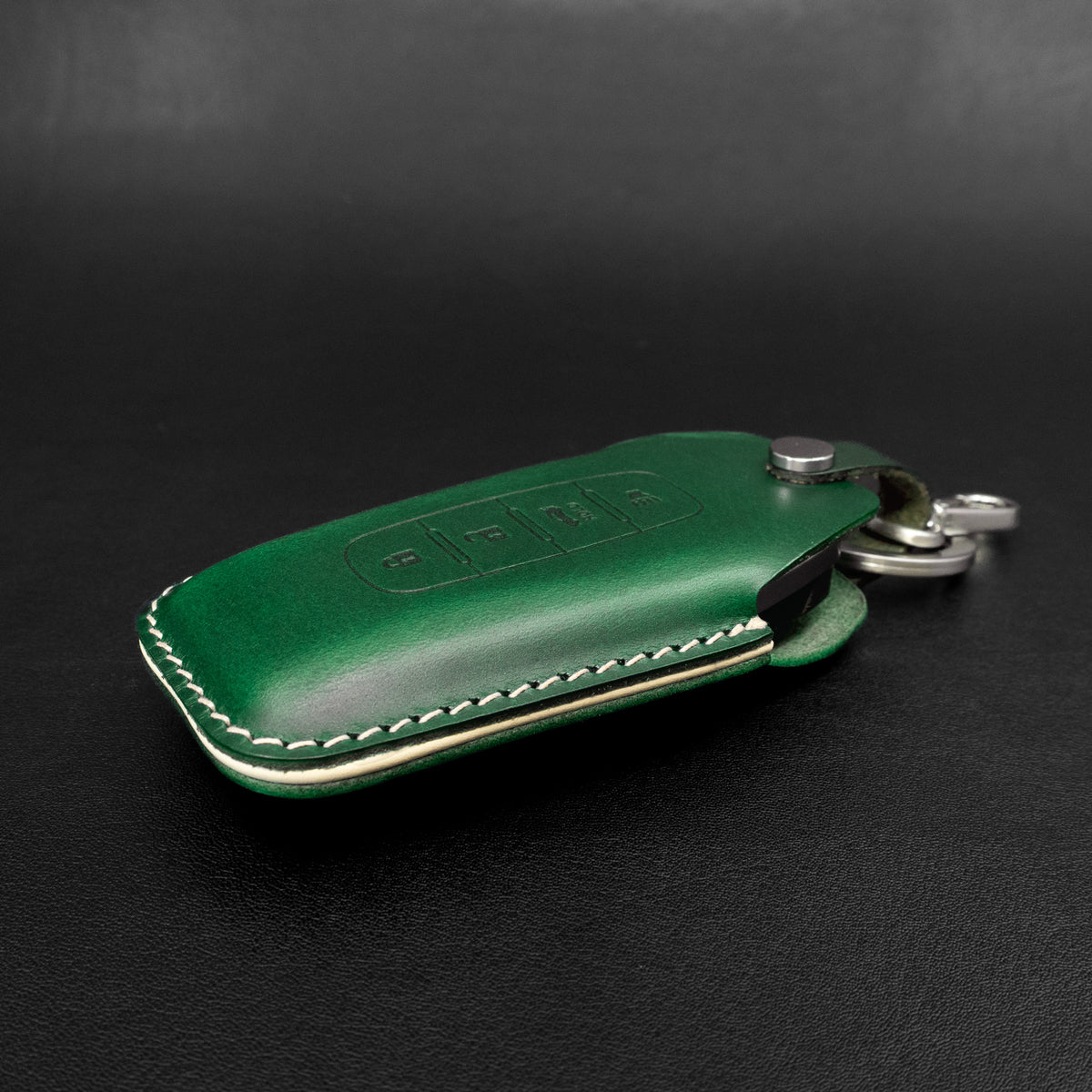 Infiniti key fob leather case shown with car interior context
