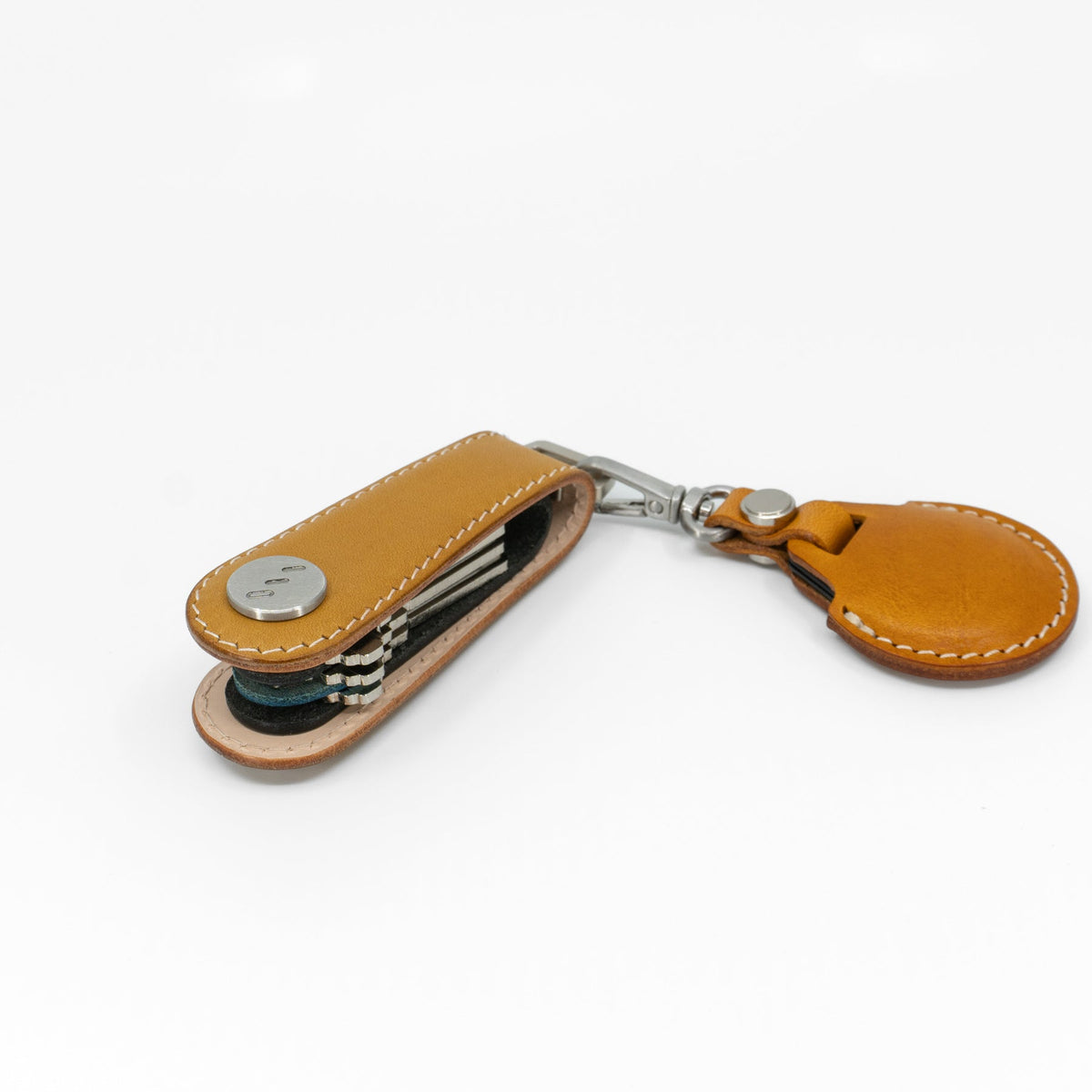 Yellow NOVONAPPA calfskin key organizer shown in packaging