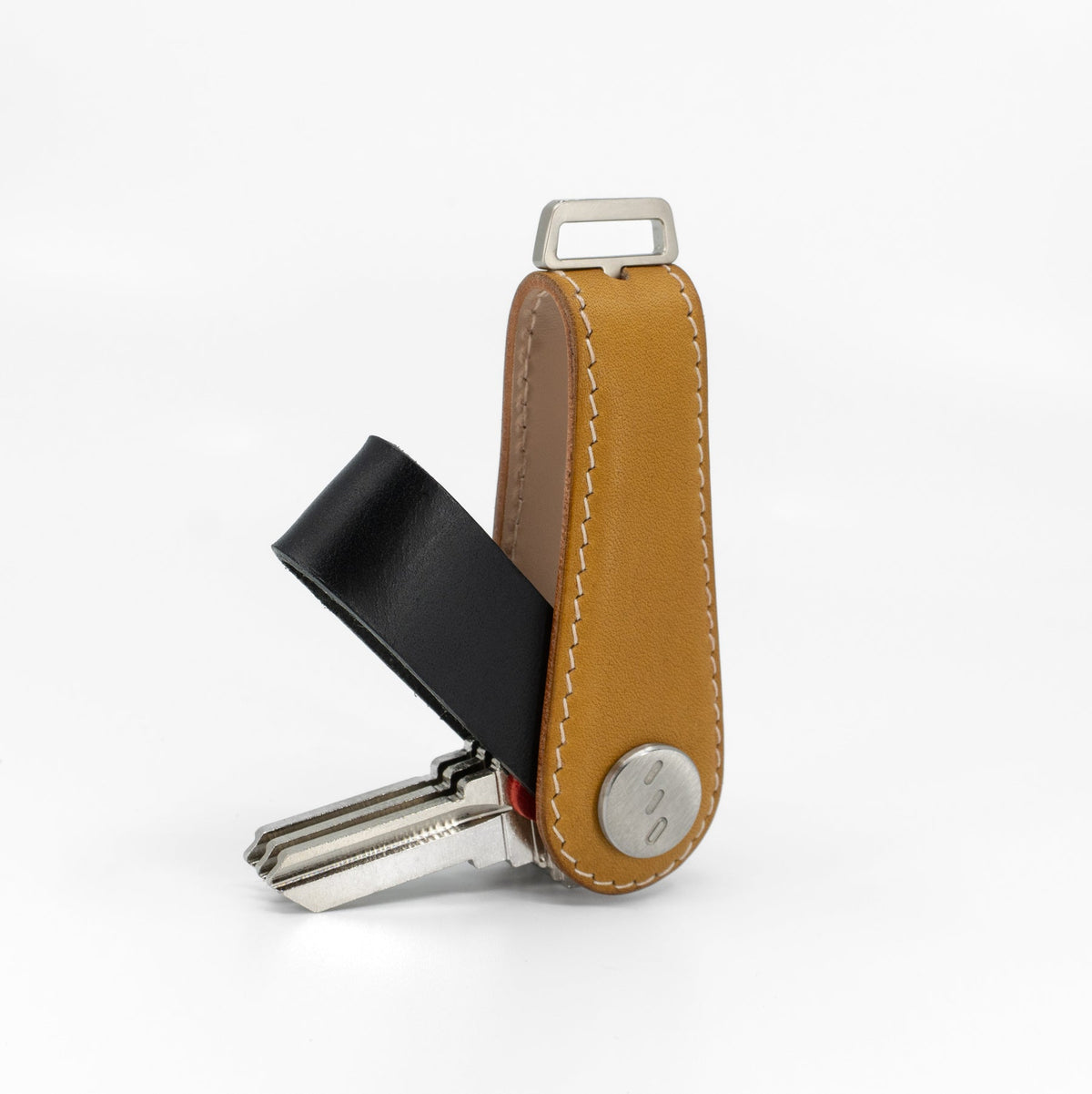 Yellow NOVONAPPA calfskin key organizer held in hand for size reference