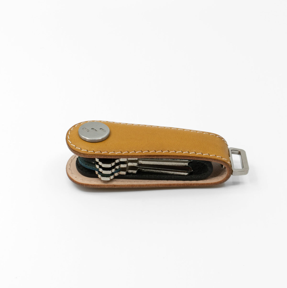 Close-up of stitching on yellow NOVONAPPA calfskin key organizer