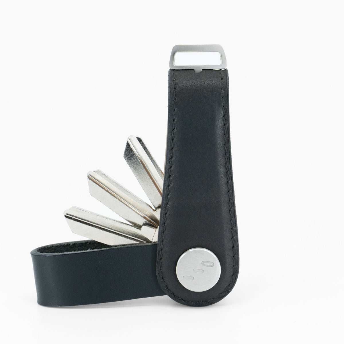 Black NOVONAPPA calfskin key organizer holding keys, side view