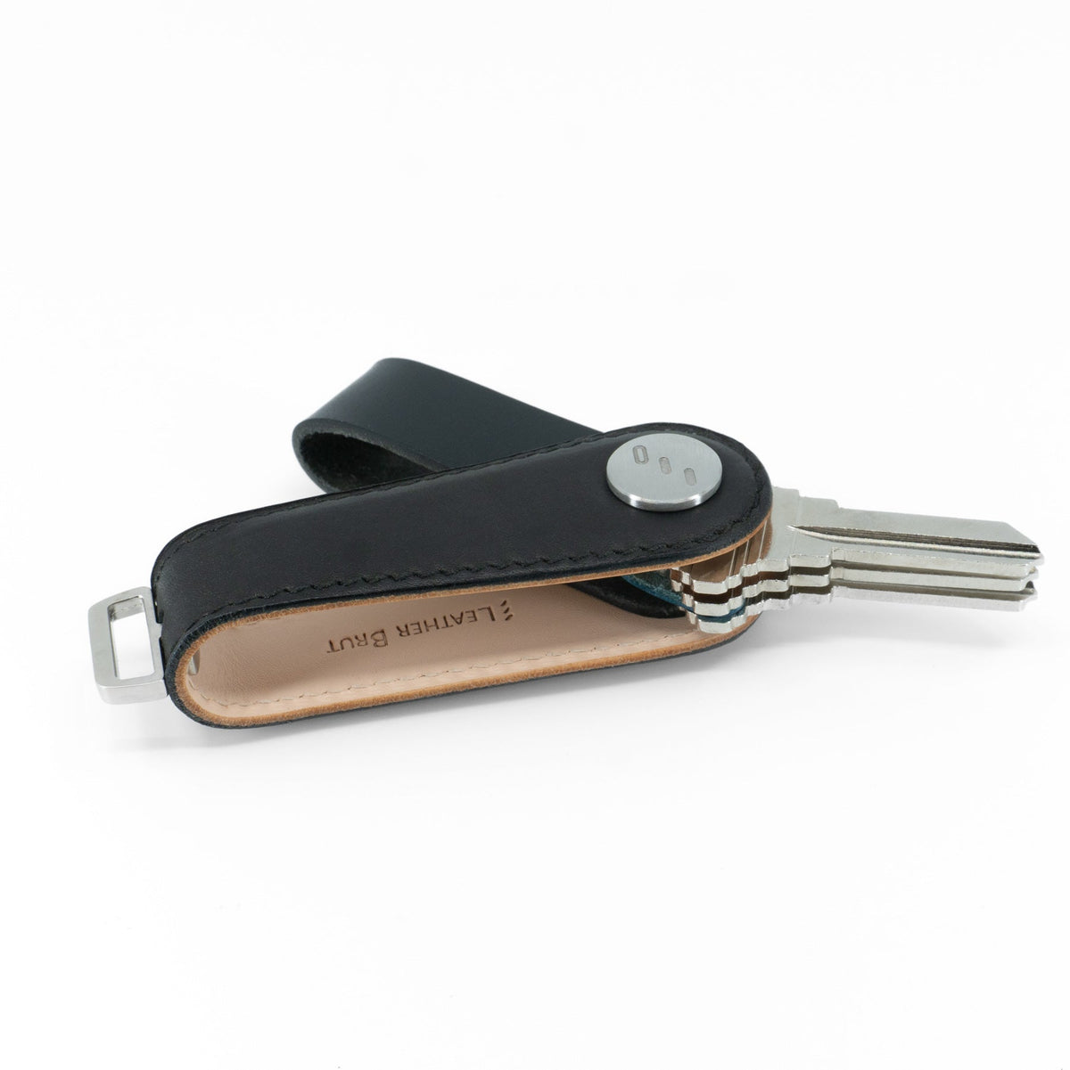 Black NOVONAPPA calfskin key organizer shown in packaging