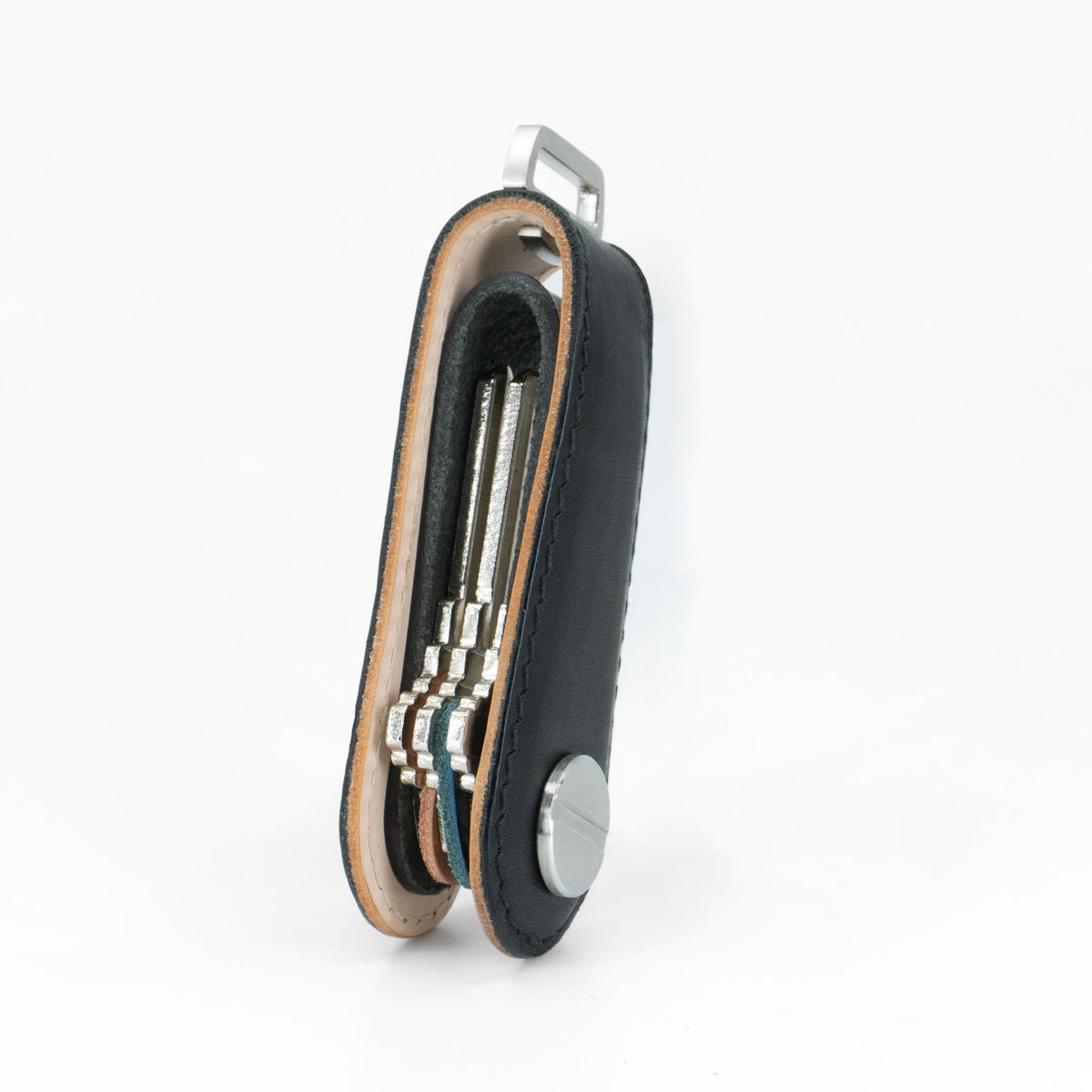 Black NOVONAPPA calfskin key organizer open with keys fanned out