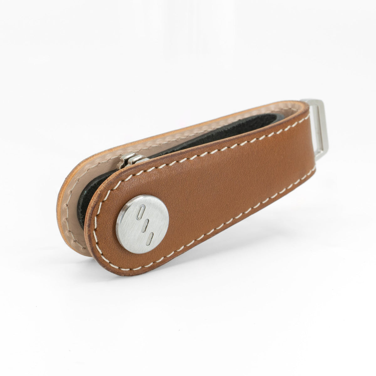 Brown NOVONAPPA calfskin key organizer shown in packaging