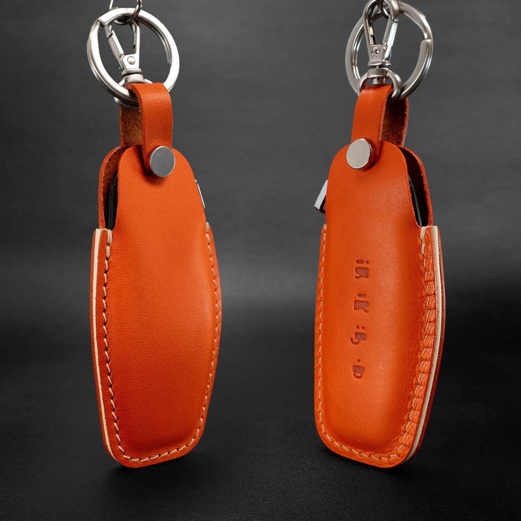 Handcrafted leather key fob cover for Lucid Air – premium fit and finish - Ora nge