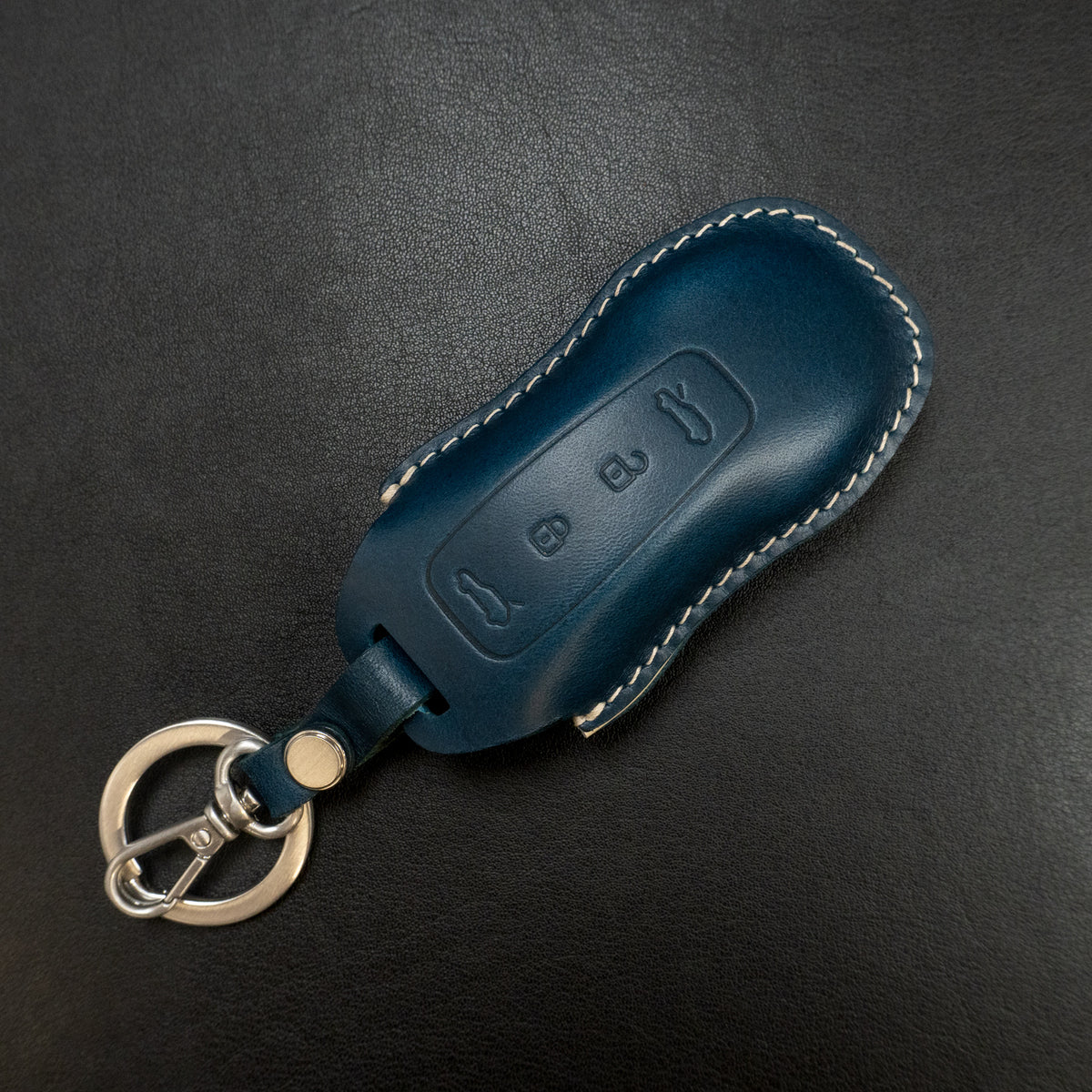 Close-up of stitching detail on Porsche Macan EV key fob leather cover
