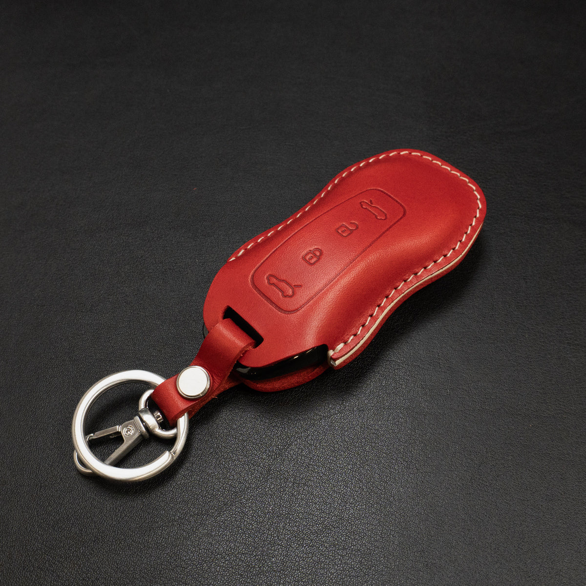 Porsche Macan EV key fob leather cover shown in packaging