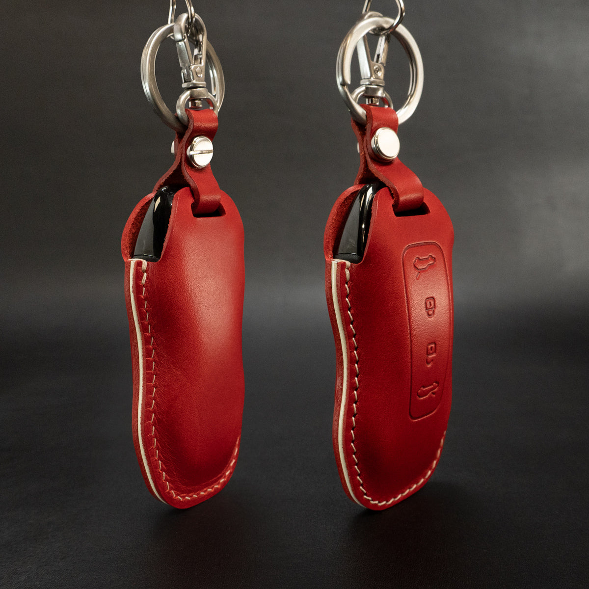 Porsche Macan EV key fob leather cover, close-up of hardware ring