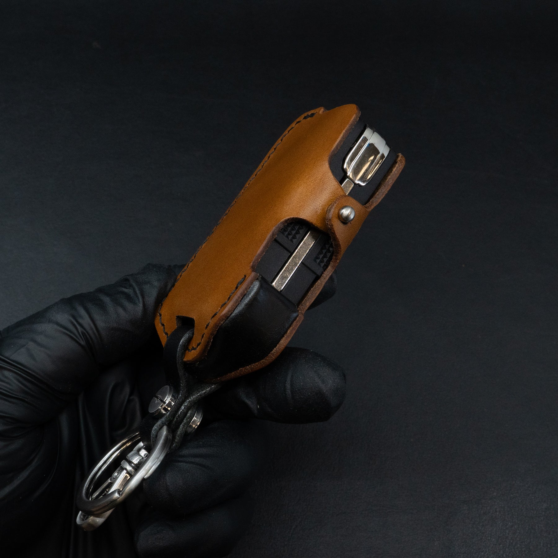 Vegetable-tanned leather key case for INEOS Grenadier - side close-up
