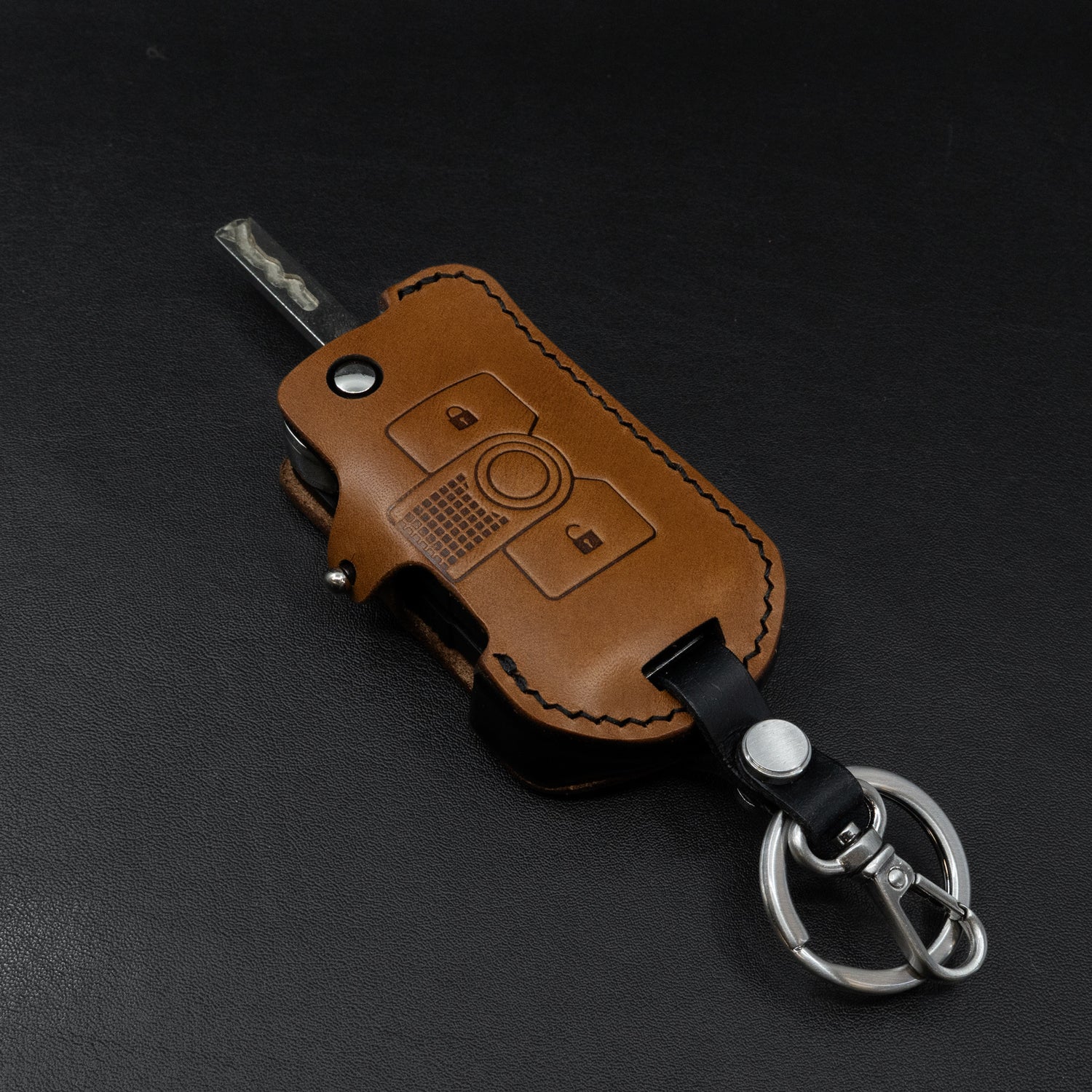 INEOS Grenadier leather key cover – brown body with black side accent detail