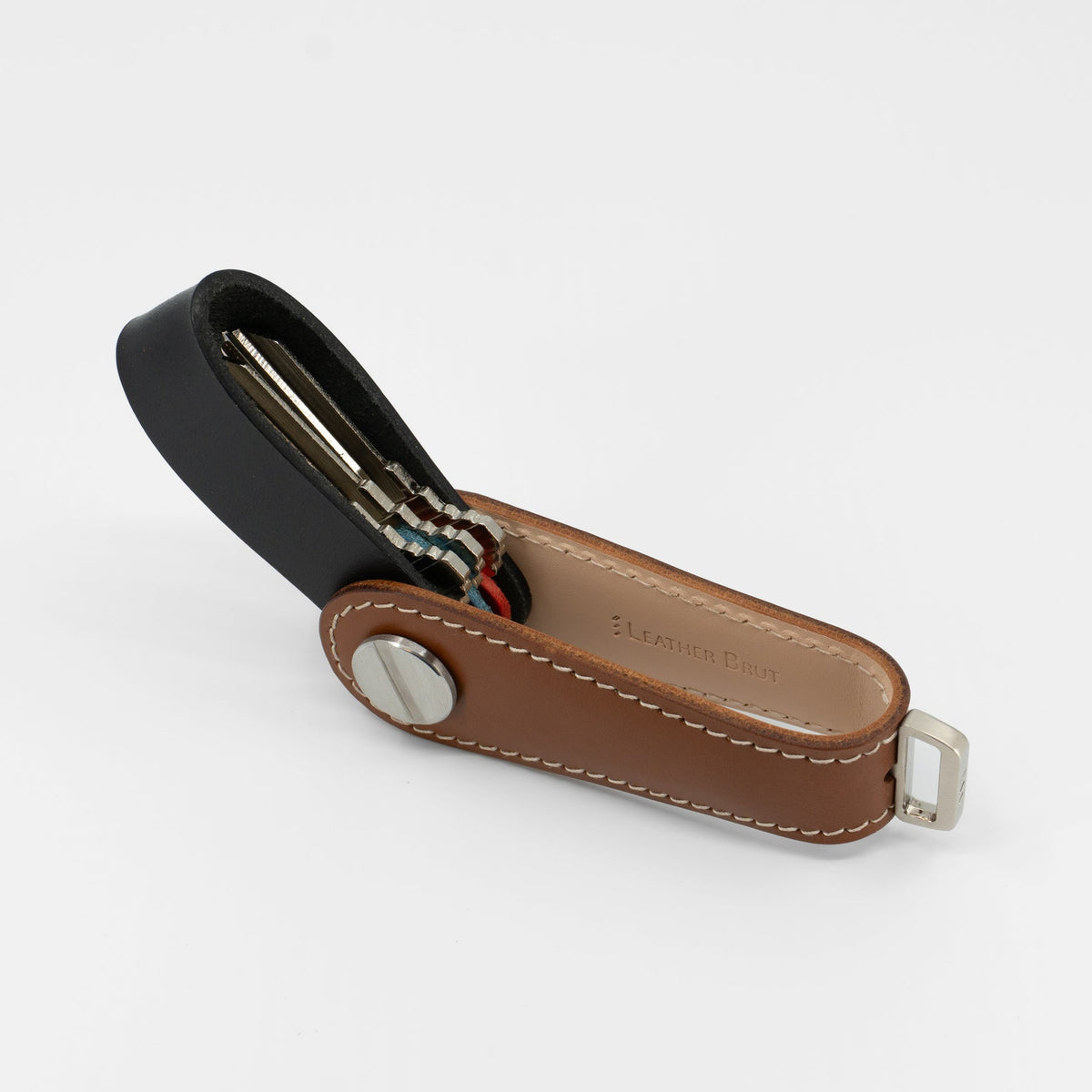 Brown Gaeta leather key organizer held in hand for size reference