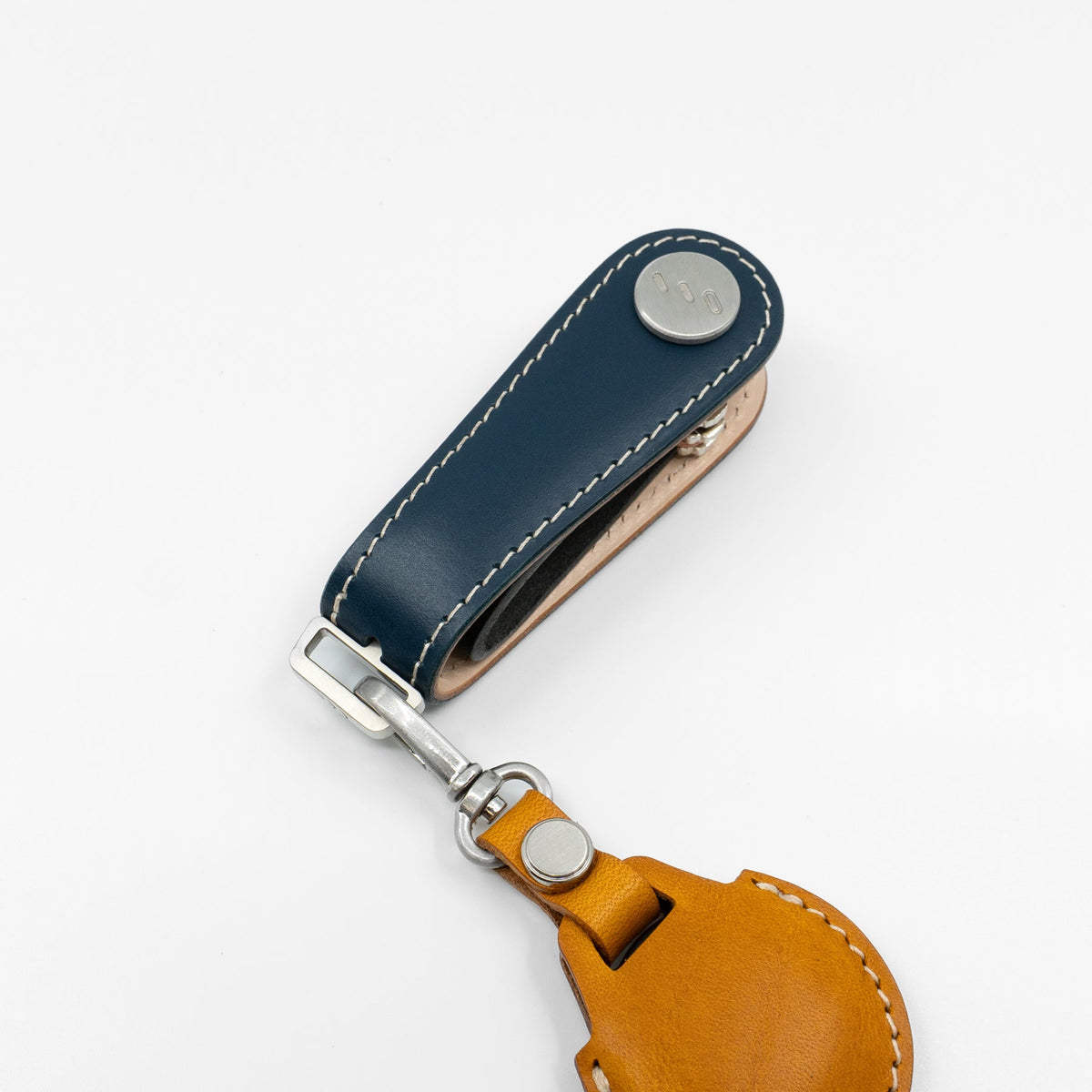 Navy Gaeta leather key organizer held in hand for size reference