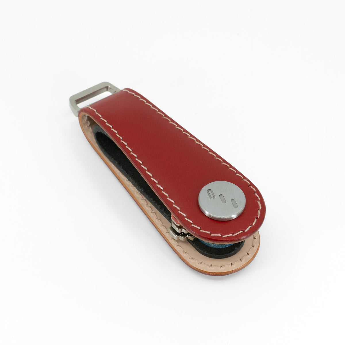 Red Gaeta leather key organizer holding keys, side view