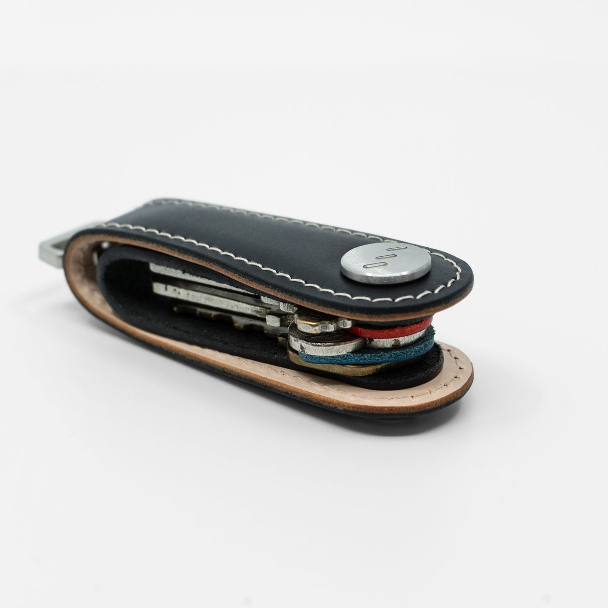 Black Gaeta leather key organizer held in hand for size reference
